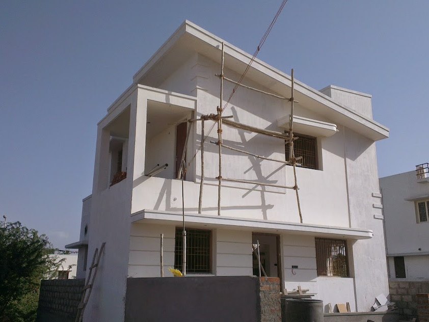 Scaffolding against the remaining elevations while finishing continues — in Pannimadai, Coimbatore